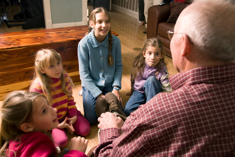 Grandfather telling a story to Grandchildren